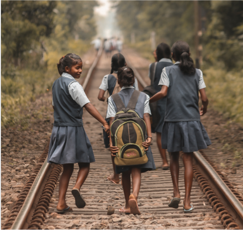 Polaroid of girls walking to school on railway tracks